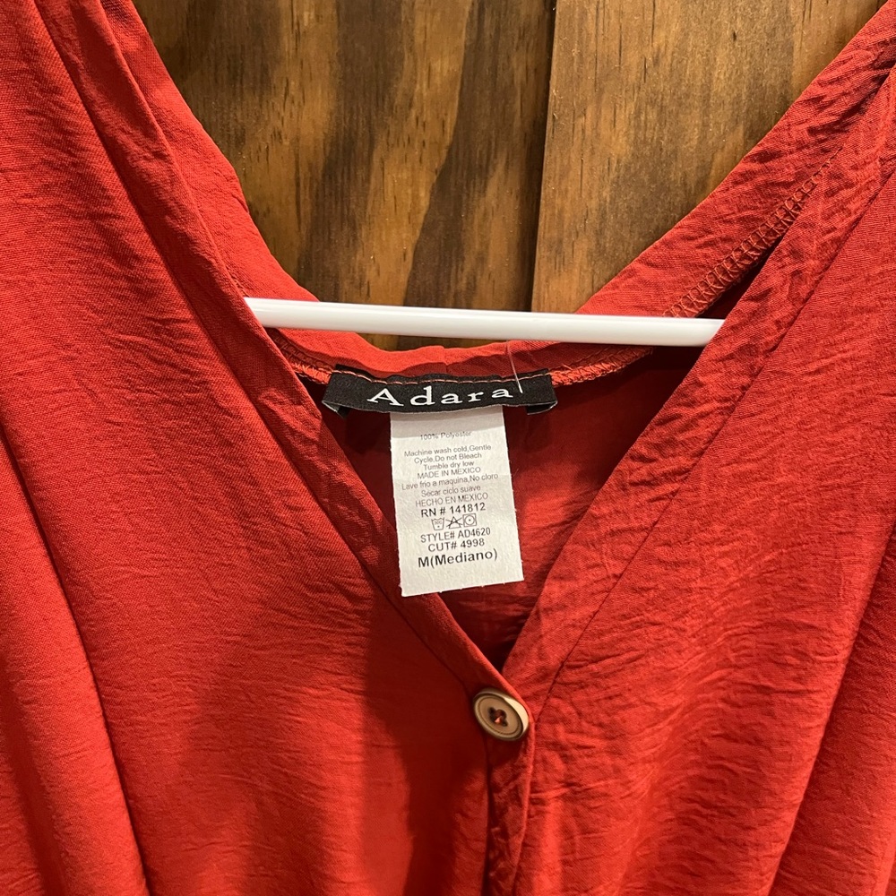 Burnt Orange. Medium. Never worn.